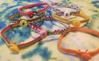 7 Fruit-Themed bracelets layed in a row