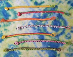 7 Fruit-Themed bracelets stacked on top of one another