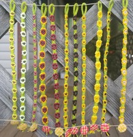 11 Sunflower-themed bracelets hanging on a hemp string side-by-side.