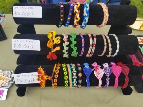 a display with woven bracelets.