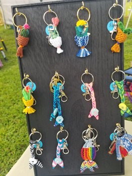 a display with woven keychains.