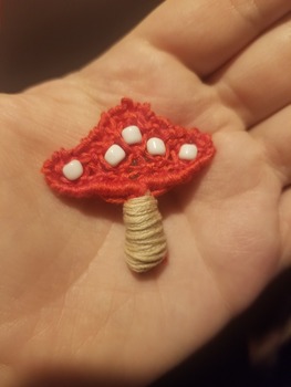 A red-capped amanita mushroom magnet.